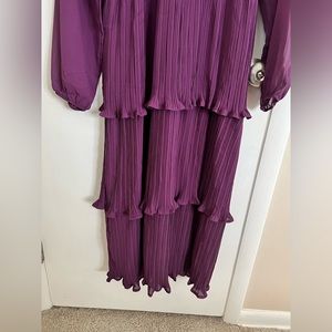 Beautiful tiered dress with sheer sleeves. Brand new, with tags, never worn.